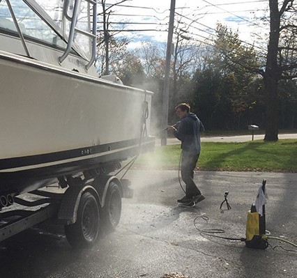 Clean hull of boat winter