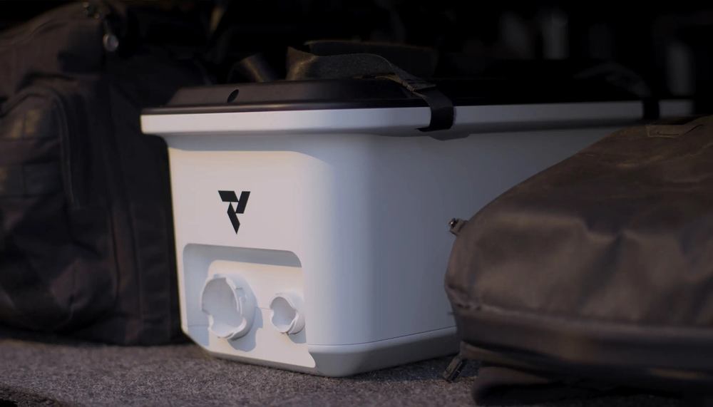 Vital Lyfe Access 25 lb portable watermaker carried by hand outdoors Vital Lyfe Access 25 lb portable watermaker carried by hand outdoors